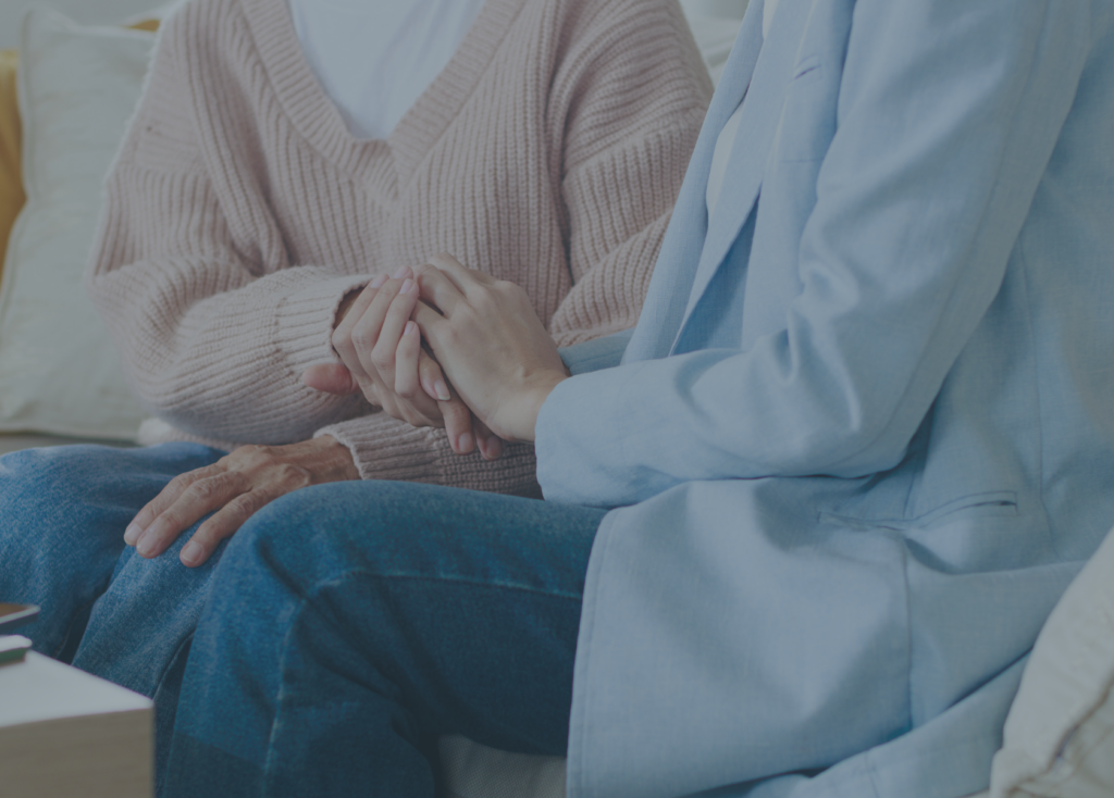 Close-up of two people holding hands