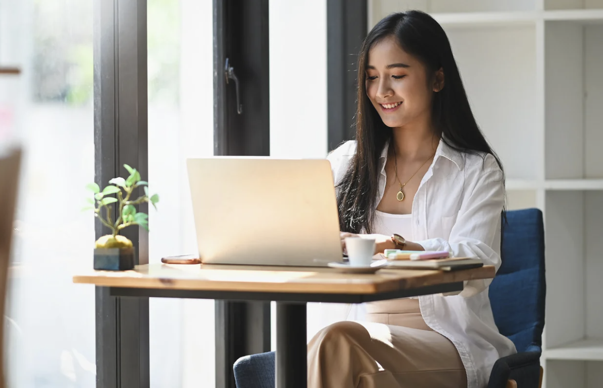 Pennsylvania EVV support specialist working at her desk with her laptop